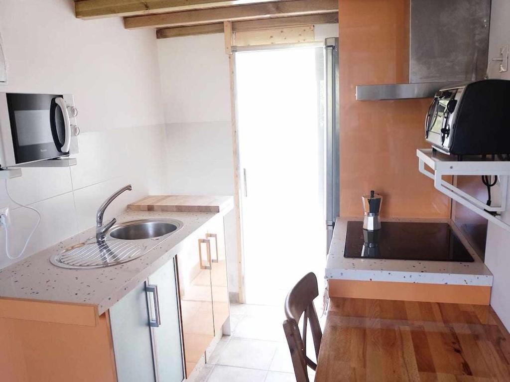Kuchyňa alebo kuchynka v ubytovaní La Casa del Druida