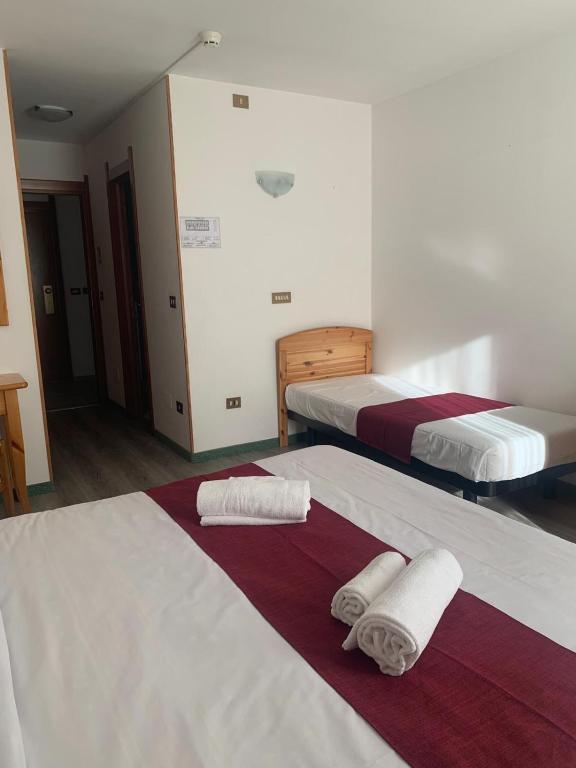 Postel nebo postele na pokoji v ubytování Hotel Fraiteve