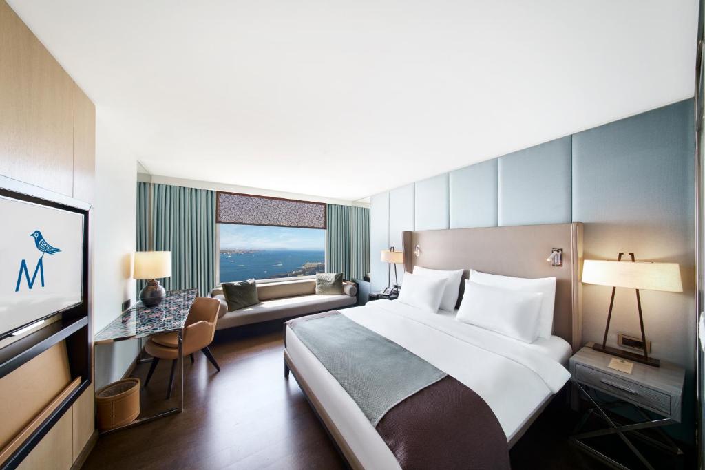 a hotel room with a large bed and a window at The Marmara Taksim in Istanbul