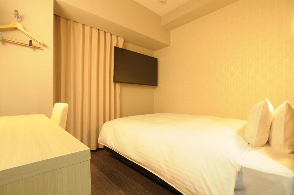 Letto o letti in una camera di AB Hotel Tahara