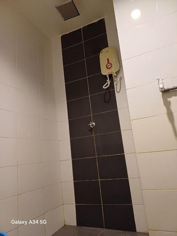 Koupelna v ubytování HomeStay De’Viana NMS Residence