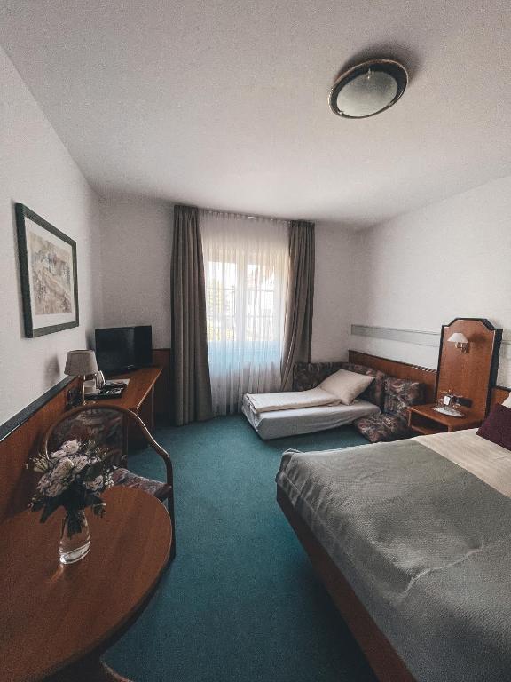 Postel nebo postele na pokoji v ubytování Hotel Tillmanns