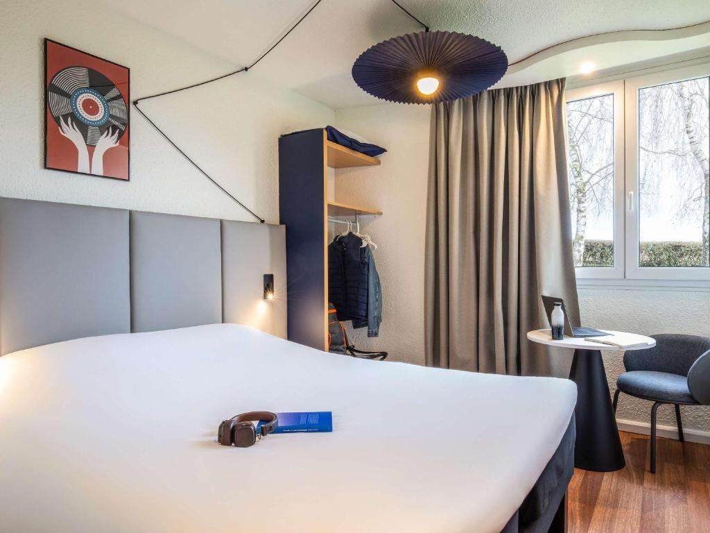 Postel nebo postele na pokoji v ubytování ibis Chalons en Champagne