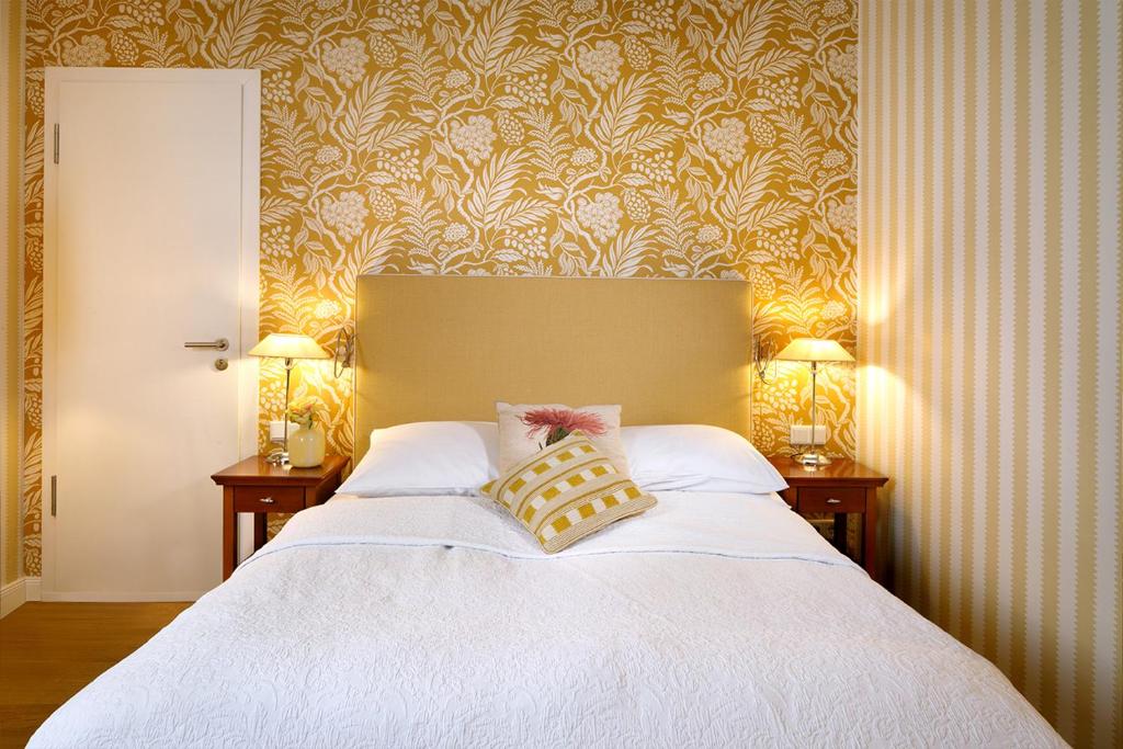 Postel nebo postele na pokoji v ubytování Hotel Goliath am Dom