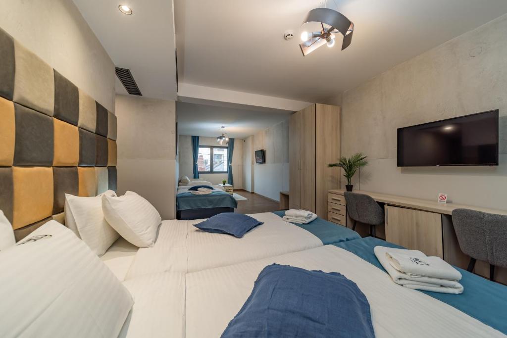 Postel nebo postele na pokoji v ubytování Hotel Garni VIZURA Sport