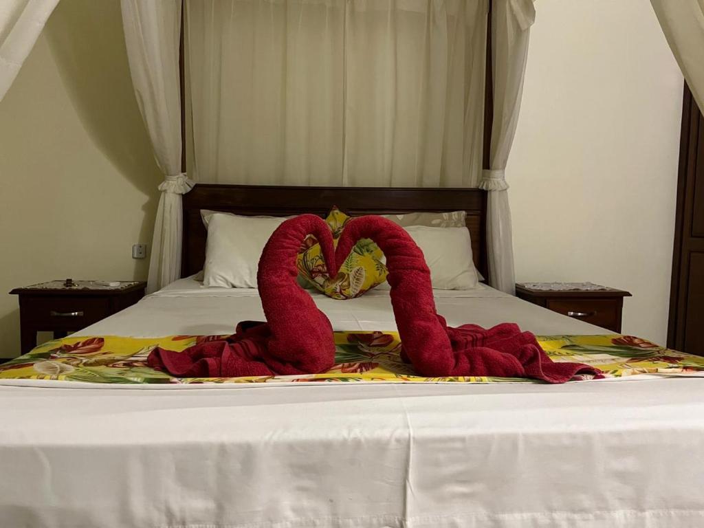 Postel nebo postele na pokoji v ubytování Azure Villa