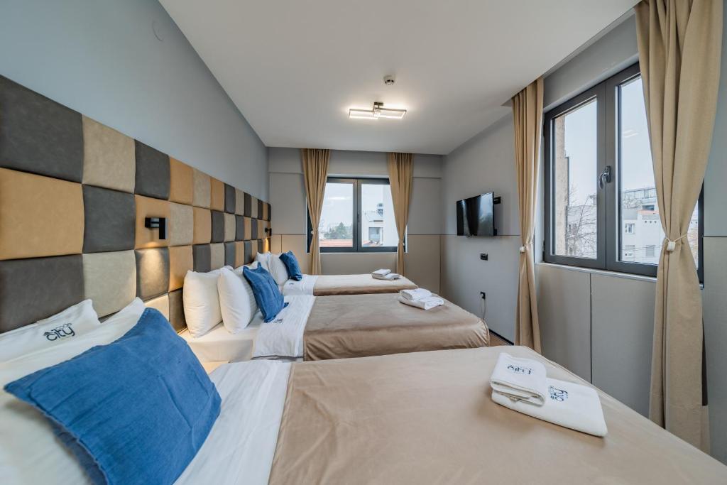 Postel nebo postele na pokoji v ubytování Hotel Garni VIZURA Sport