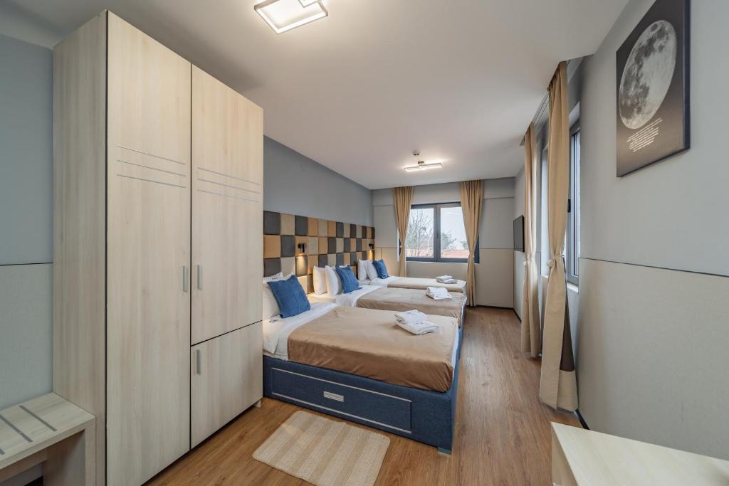 Postel nebo postele na pokoji v ubytování Hotel Garni VIZURA Sport