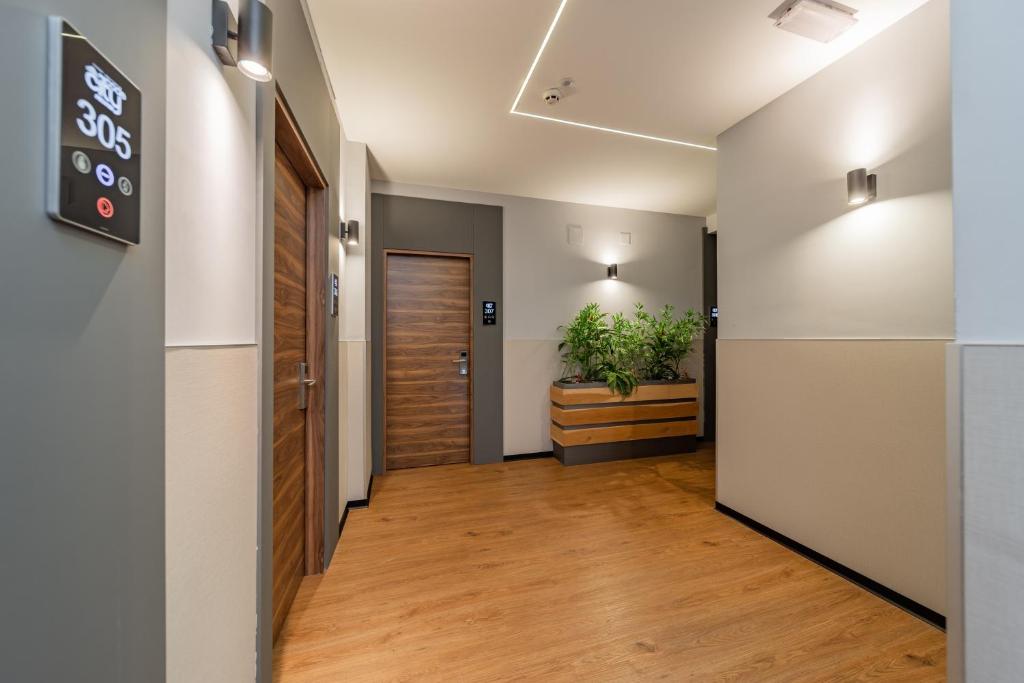 TV a/nebo společenská místnost v ubytování Hotel Garni VIZURA Sport