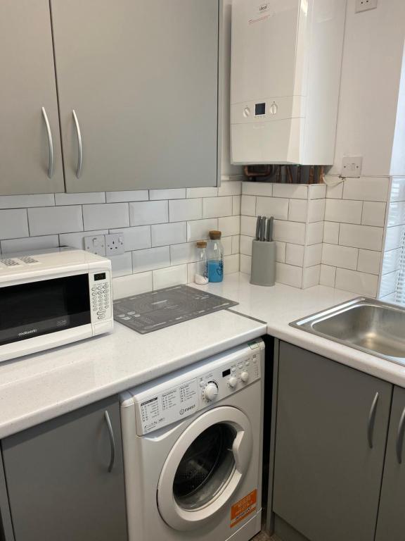 A cozinha ou cozinha compacta de Beach Front House