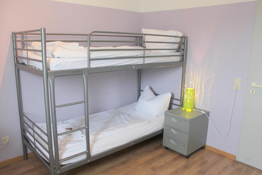 Postel nebo postele na pokoji v ubytování StayInn Hostel und Gästehaus