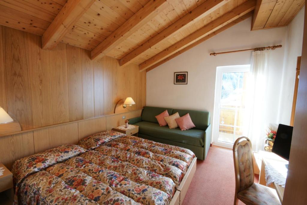 Postel nebo postele na pokoji v ubytování Hotel Villa Cima Undici
