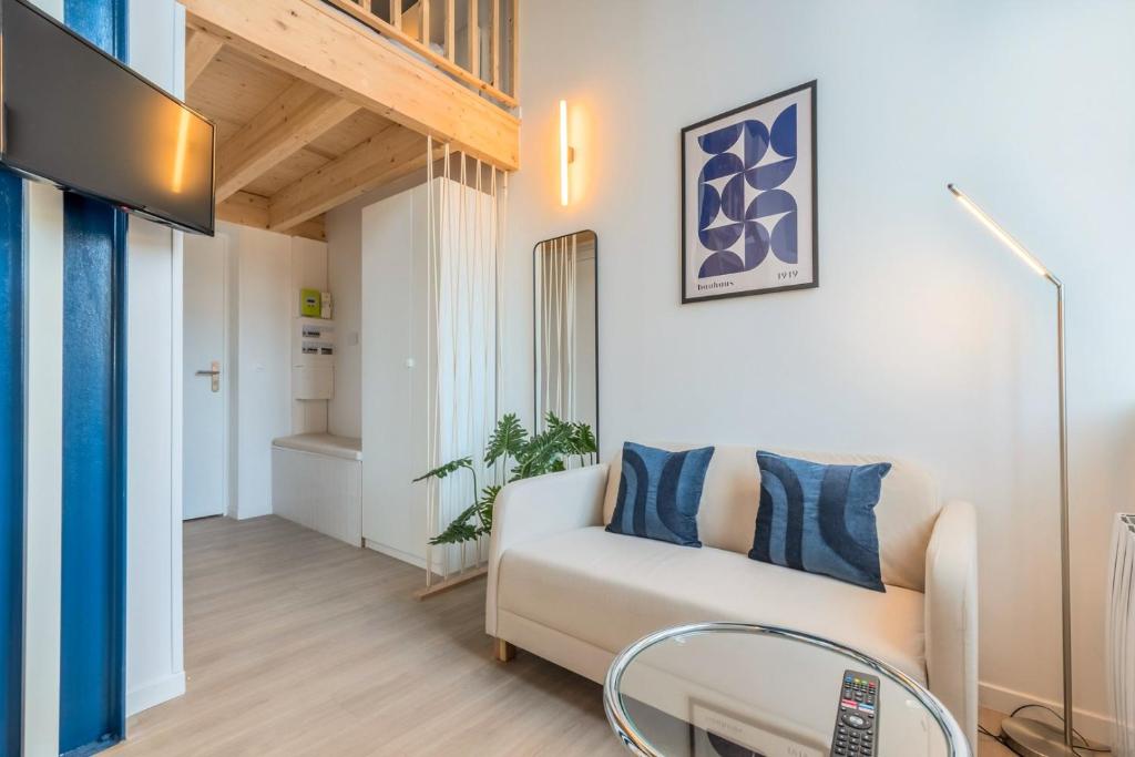 Ένα ή περισσότερα κρεβάτια σε δωμάτιο στο Studio pour deux personnes en mezzanine