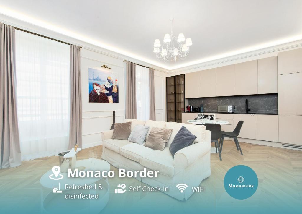 un salon avec un canapé blanc et une cuisine dans l'établissement 2mn Monaco - Rénovation Luxe - CU, à Beausoleil