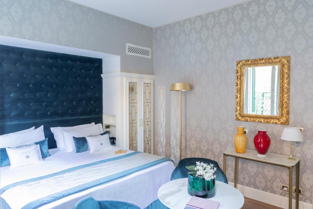 Postel nebo postele na pokoji v ubytování Londra Palace Venezia