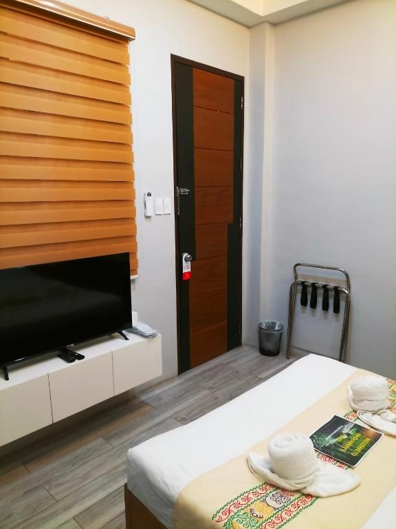 TV a/nebo společenská místnost v ubytování Dachannry's Place Hotel