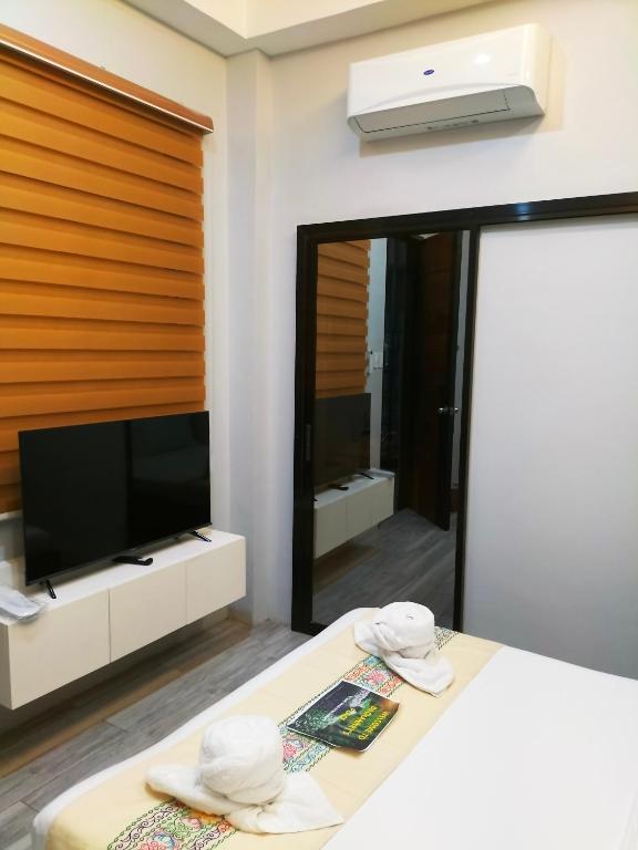 TV a/nebo společenská místnost v ubytování Dachannry's Place Hotel