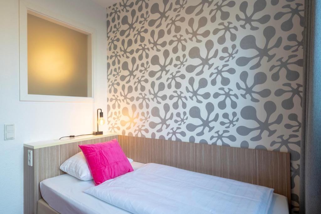 Postel nebo postele na pokoji v ubytování Hotel Madeleine Biohotel