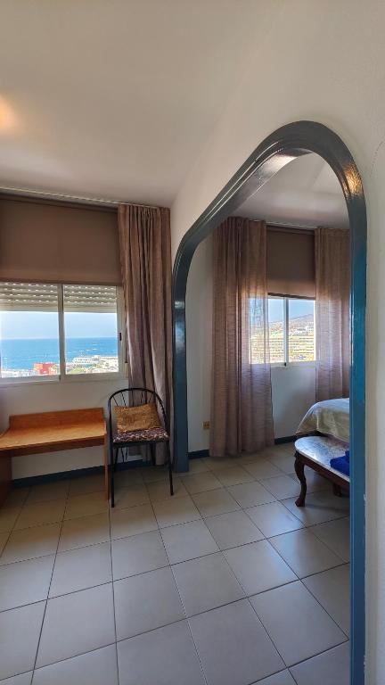 A bed or beds in a room at Apartamento Palmeras Del Sur