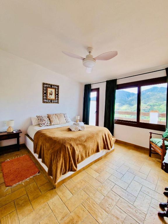 Postel nebo postele na pokoji v ubytování G&G Carratraca Village - Caminito del Rey