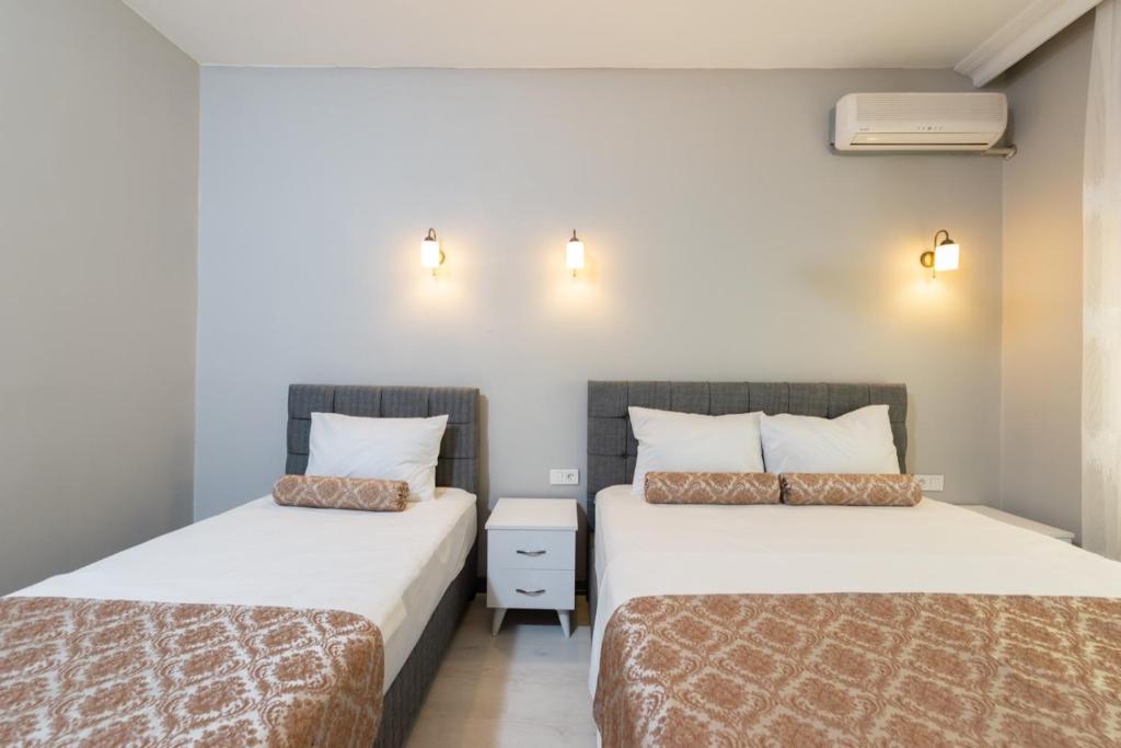 Postel nebo postele na pokoji v ubytování Galley Port Hotel