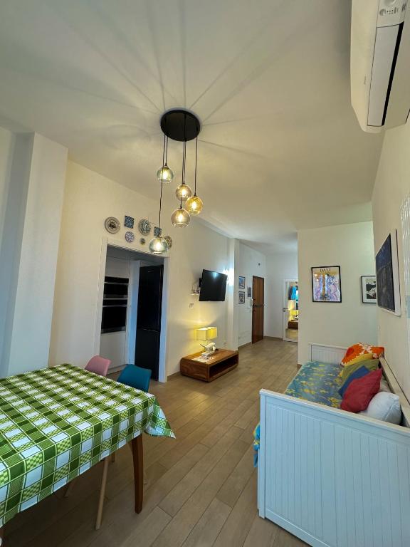a bedroom with a bed and a living room at Appartamento da Francesca in Casalecchio di Reno