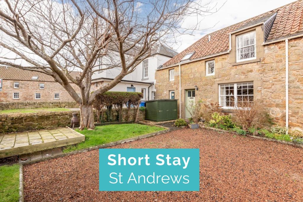 an image of a brick house with the words short stay st alphres at Smiddy Burn Cottage Kingsbarns in Kingsbarns