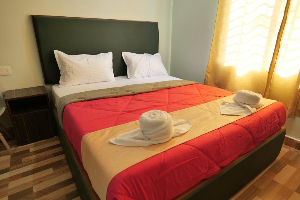 Postel nebo postele na pokoji v ubytování Hotel HK Regency