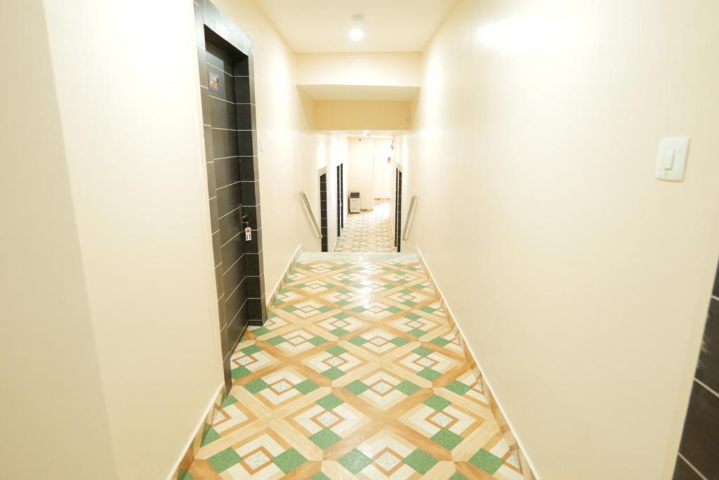 Postel nebo postele na pokoji v ubytování Hotel HK Regency