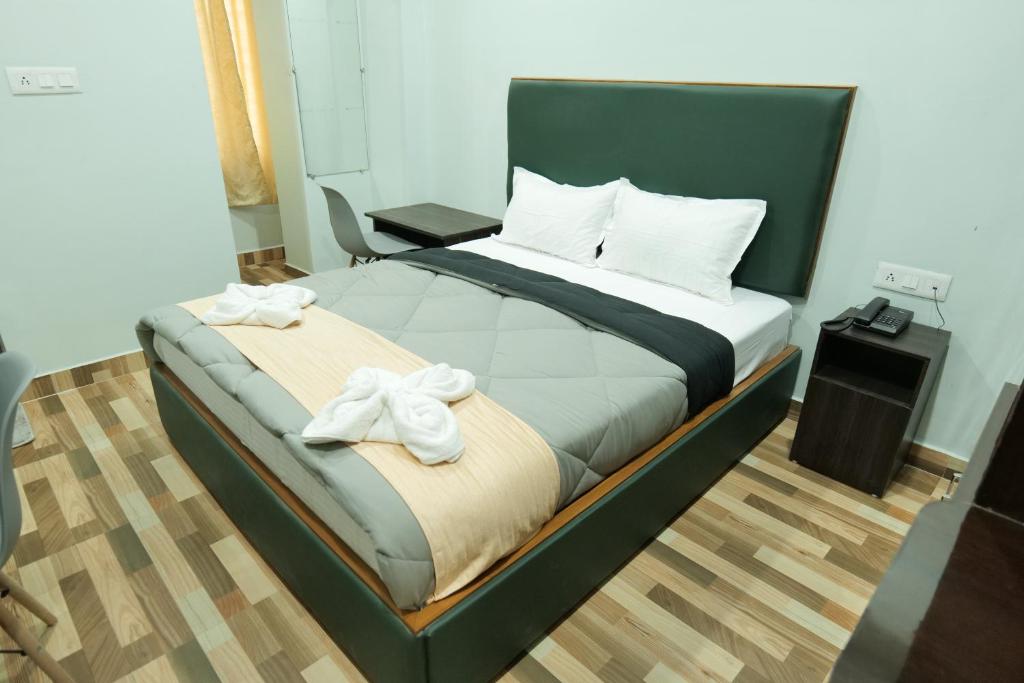 Postel nebo postele na pokoji v ubytování Hotel HK Regency