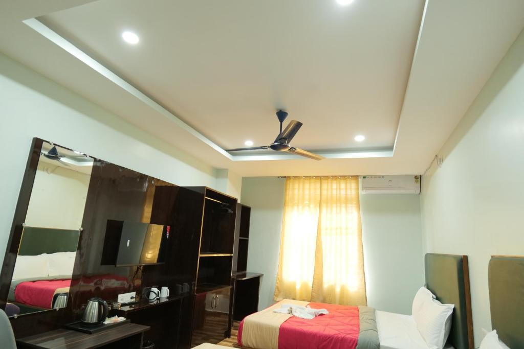 Postel nebo postele na pokoji v ubytování Hotel HK Regency
