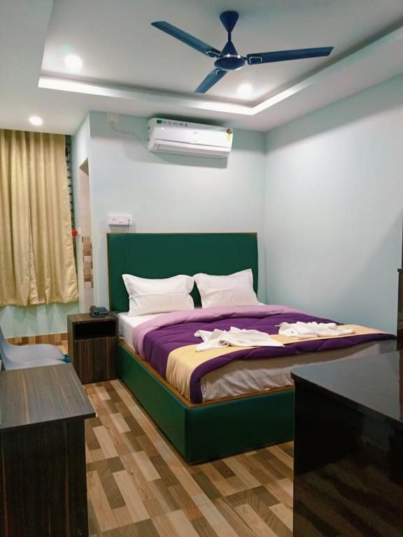 Postel nebo postele na pokoji v ubytování Hotel HK Regency