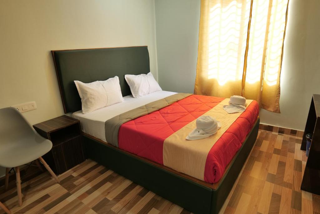 Postel nebo postele na pokoji v ubytování Hotel HK Regency