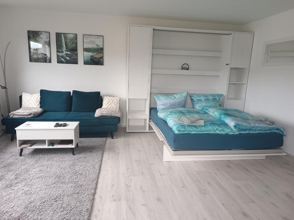 a living room with a couch and a bed at Apartment mit Rheinblick in Oberdiebach