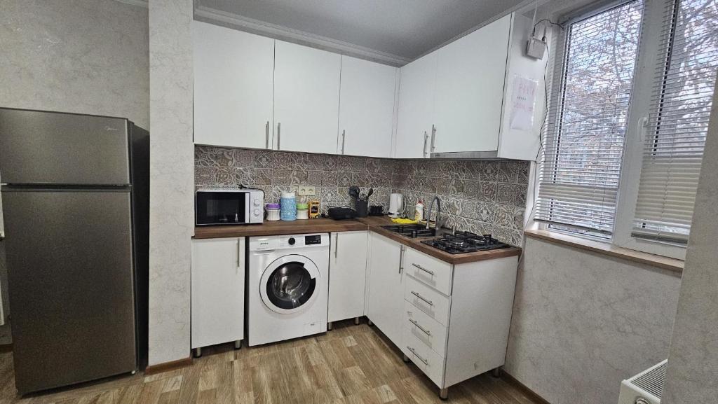 Kuchyň nebo kuchyňský kout v ubytování Apartment Oxalis