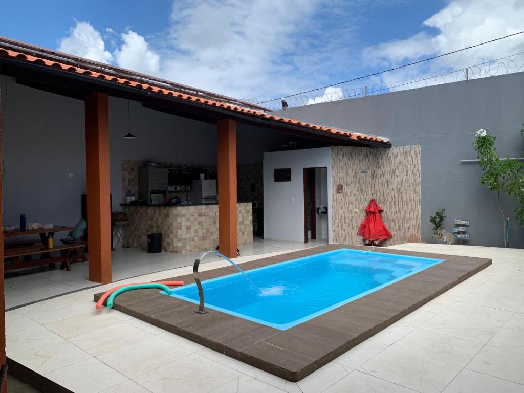 a swimming pool on the patio of a house at casa sol e mar 01 in Paripueira