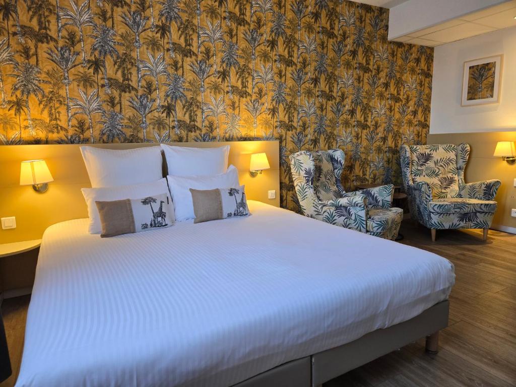 Postel nebo postele na pokoji v ubytování Hôtel Le SAINT-GENIÈS
