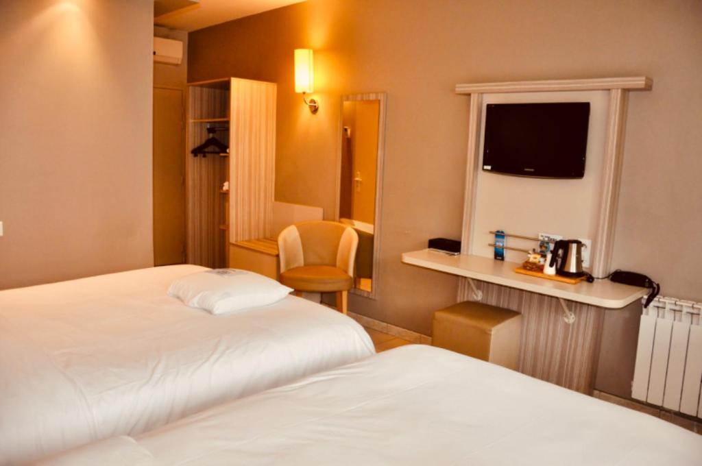 Letto o letti in una camera di Kyriad Toulouse Sud - Roques