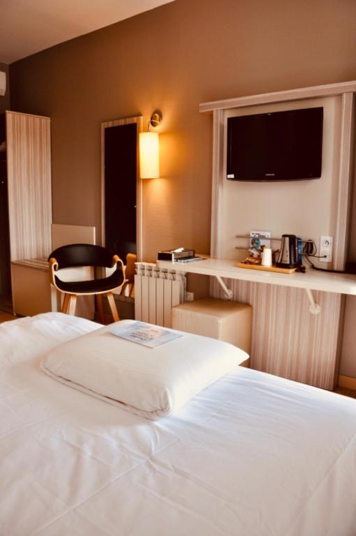 Letto o letti in una camera di Kyriad Toulouse Sud - Roques