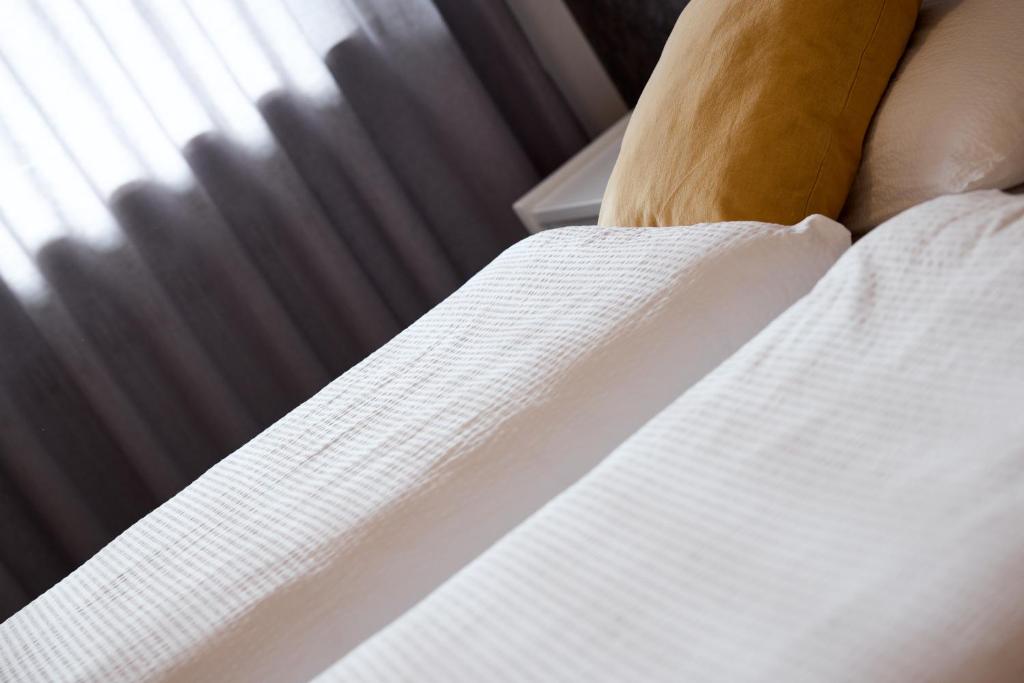 Łóżko lub łóżka w pokoju w obiekcie Apartment Steinach