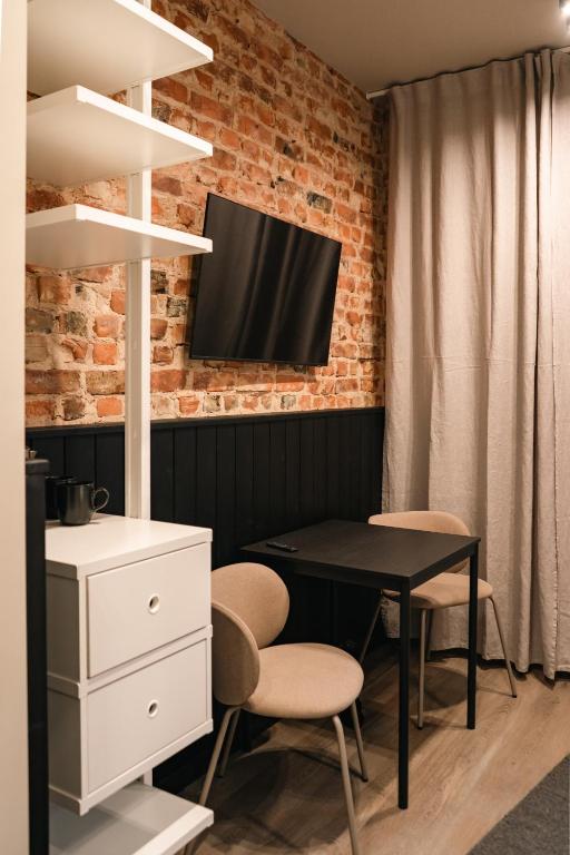 TV a/nebo společenská místnost v ubytování Kaķītis hotel & spa