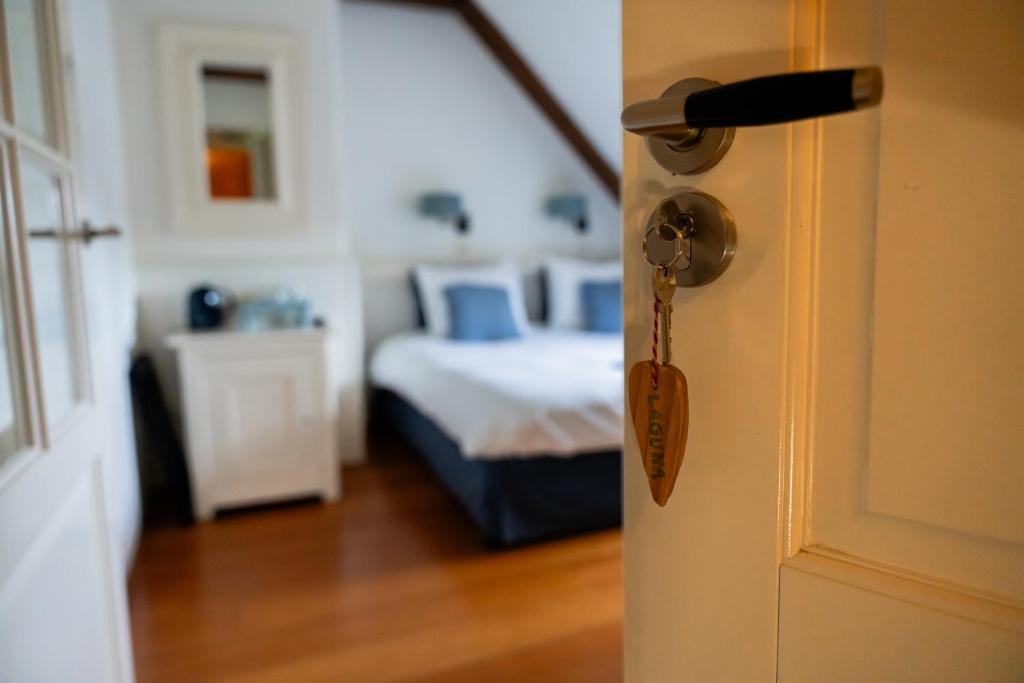 Postel nebo postele na pokoji v ubytování B&B Het Wellnest