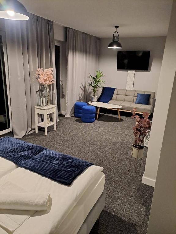 Postel nebo postele na pokoji v ubytování Ohouse aparts