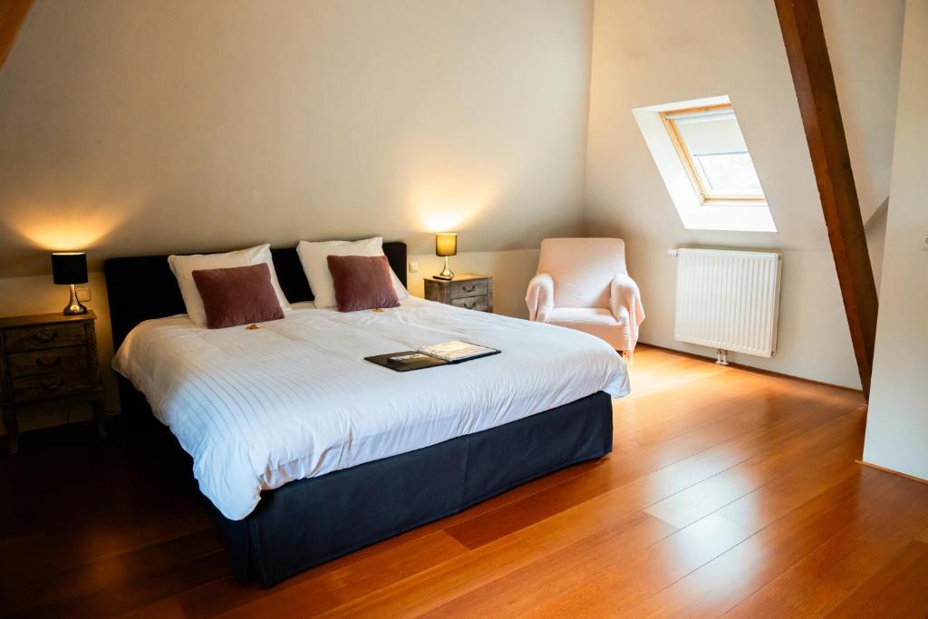 Postel nebo postele na pokoji v ubytování B&B Het Wellnest