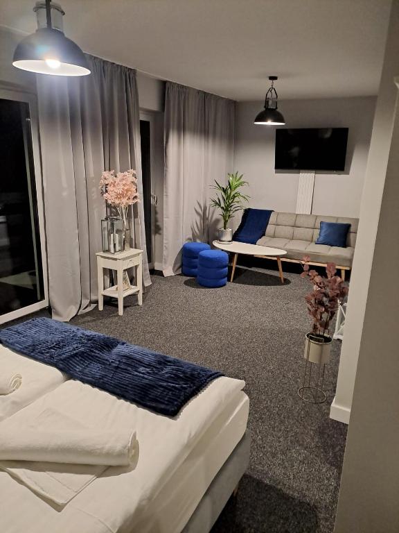 Postel nebo postele na pokoji v ubytování Ohouse aparts