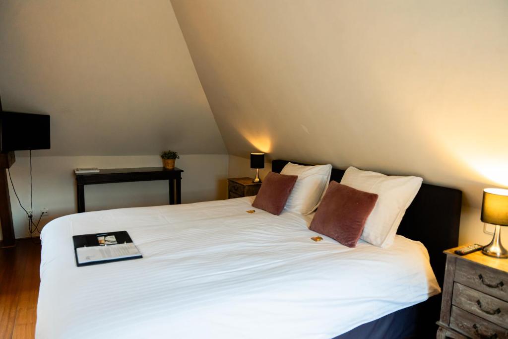 Postel nebo postele na pokoji v ubytování B&B Het Wellnest