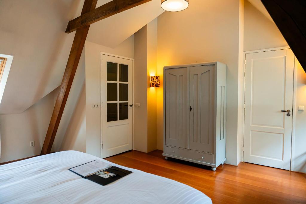 Postel nebo postele na pokoji v ubytování B&B Het Wellnest