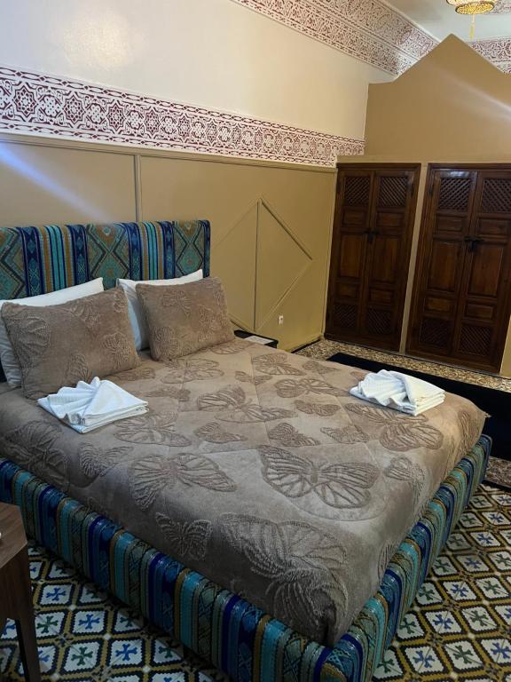 Postel nebo postele na pokoji v ubytování Riad La Perla Bianca