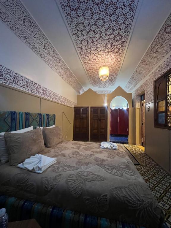 Postel nebo postele na pokoji v ubytování Riad La Perla Bianca