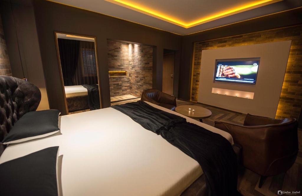 TV a/nebo společenská místnost v ubytování Vera HOTEL-VILLA